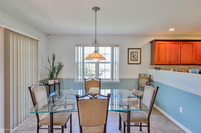 dining area featuring light tile patterned floors, recessed lighting, and baseboards