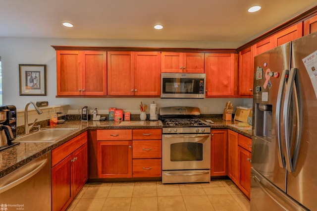 kitchen featuring stainless steel appliances, a sink, recessed lighting, and light tile patterned floors