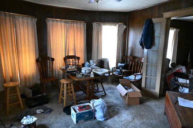 595 N Courtland St, East Stroudsburg, PA 18301 - dining area with carpet floors, ceiling fan, and wooden walls