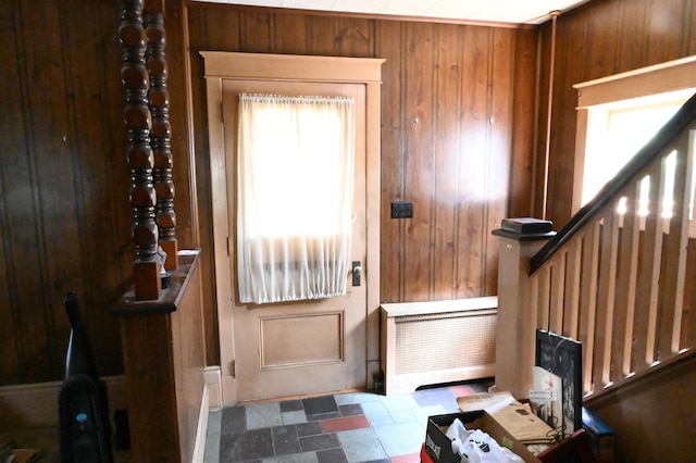 595 N Courtland St, East Stroudsburg, PA 18301 - entryway featuring wooden walls, radiator, and stairs
