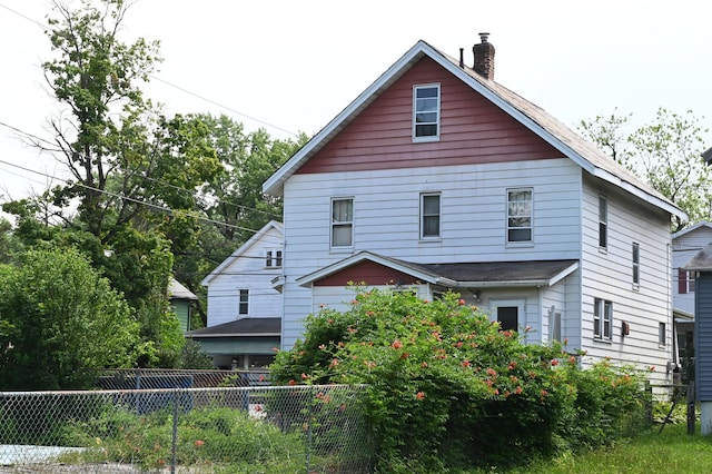 595 N Courtland St, East Stroudsburg, PA 18301 - back of house featuring a chimney
