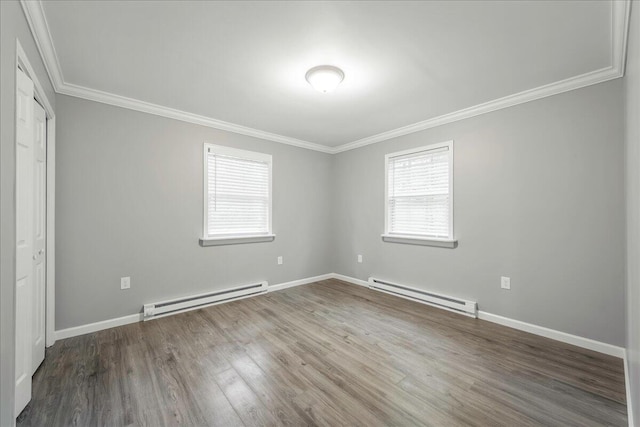 1572 Gardner Rd, Stroudsburg, PA 18360 - unfurnished bedroom with a baseboard heating unit, crown molding, multiple windows, and wood finished floors