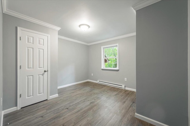 1572 Gardner Rd, Stroudsburg, PA 18360 - spare room with a baseboard radiator, wood finished floors, and ornamental molding