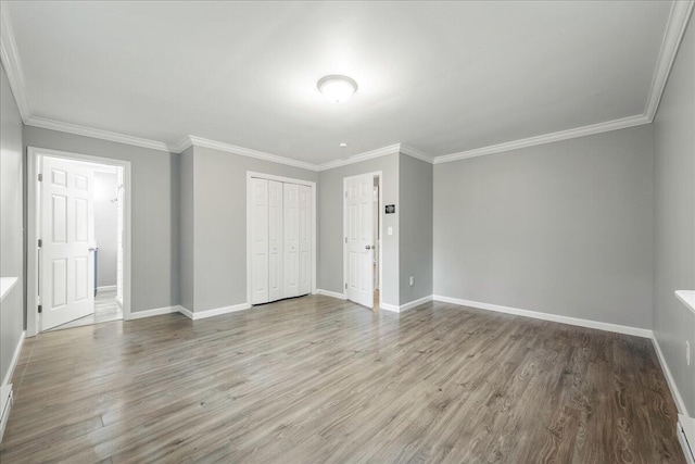 1572 Gardner Rd, Stroudsburg, PA 18360 - unfurnished bedroom with wood finished floors, ornamental molding, and a closet