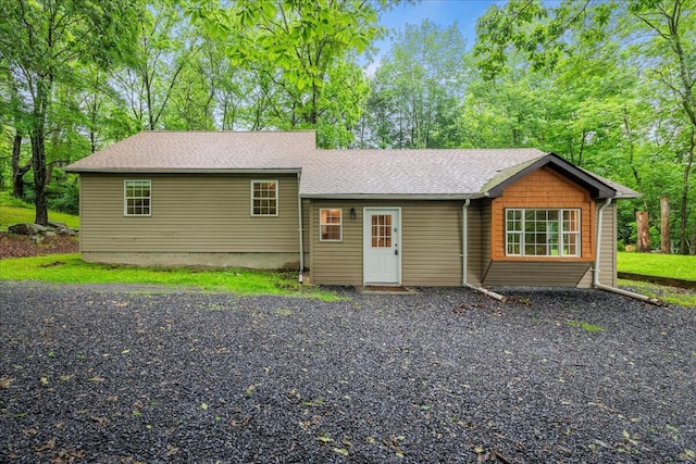 1572 Gardner Rd, Stroudsburg, PA 18360 - view of front of property with a shingled roof and view of wooded area
