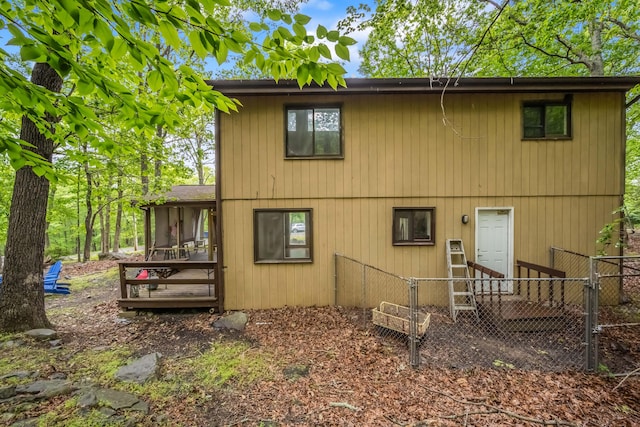 2166 Southport Dr, Bushkill, PA 18324 - rear view of house featuring a sunroom