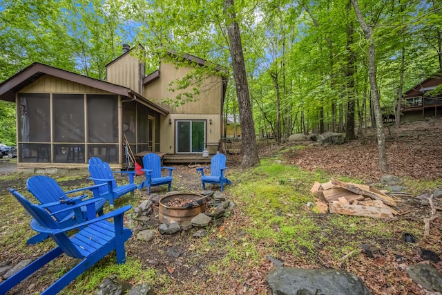 2166 Southport Dr, Bushkill, PA 18324 - view of yard featuring an outdoor fire pit and a sunroom
