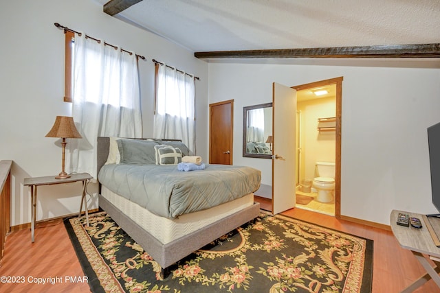 244 High Pass Way, Tannersville, PA 18372 - bedroom with vaulted ceiling with beams, light wood-type flooring, ensuite bath, and baseboards