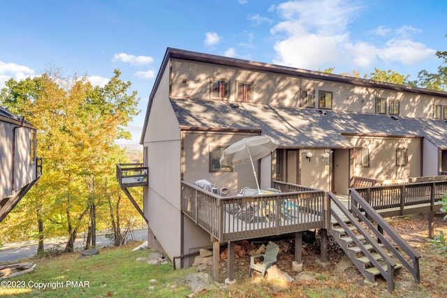 244 High Pass Way, Tannersville, PA 18372 - rear view of property featuring a shingled roof and a wooden deck