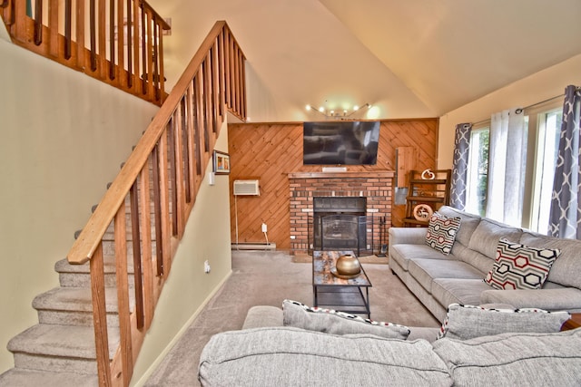 594 Sullivan Trl, Long Pond, PA 18334 - living room featuring wood walls, carpet floors, stairway, a baseboard heating unit, and a fireplace