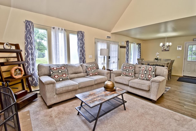 594 Sullivan Trl, Long Pond, PA 18334 - living area with a chandelier, wood finished floors, and high vaulted ceiling