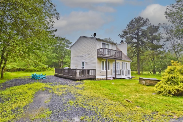 594 Sullivan Trl, Long Pond, PA 18334 - back of property with a balcony, a chimney, a deck, and a lawn