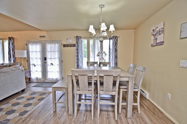 594 Sullivan Trl, Long Pond, PA 18334 - dining area with french doors, a chandelier, and wood finished floors