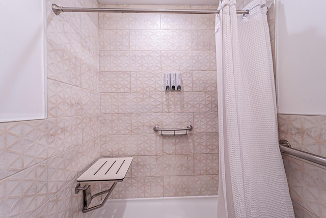 bathroom with a tile shower