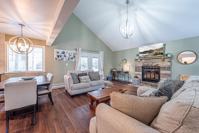 living room with a chandelier, a stone fireplace, a baseboard radiator, and dark wood-style floors