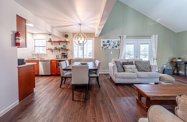 living area with dark wood-style floors, french doors, and an inviting chandelier