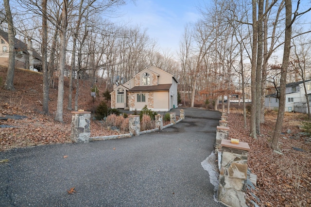 view of street with aphalt driveway