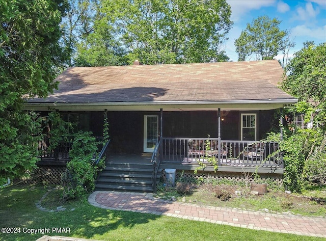 188 Olde Schoolhouse Rd, Cresco, PA 18326 - view of front of property featuring a porch, a chimney, and roof with shingles