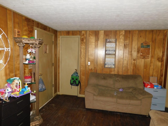 1212 Lower Cherry Valley Rd, Stroudsburg, PA 18360 - living room featuring wooden walls, baseboards, and hardwood / wood-style floors