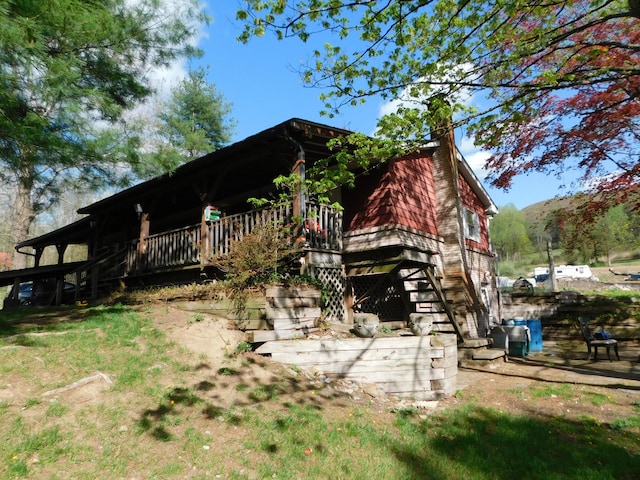 1212 Lower Cherry Valley Rd, Stroudsburg, PA 18360 - view of property exterior with a chimney, stairs, and a wooden deck