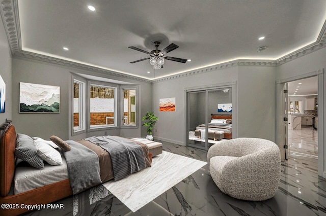 bedroom with ceiling fan, marble finish floor, a tray ceiling, a closet, and recessed lighting