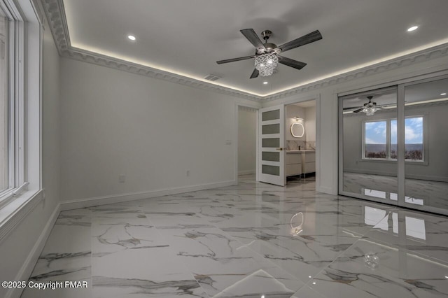 empty room with visible vents, baseboards, a ceiling fan, marble finish floor, and recessed lighting