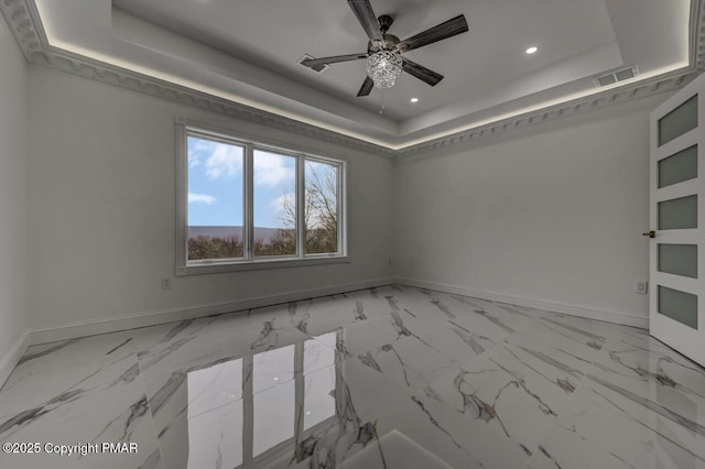 unfurnished room featuring baseboards, visible vents, a raised ceiling, a ceiling fan, and recessed lighting