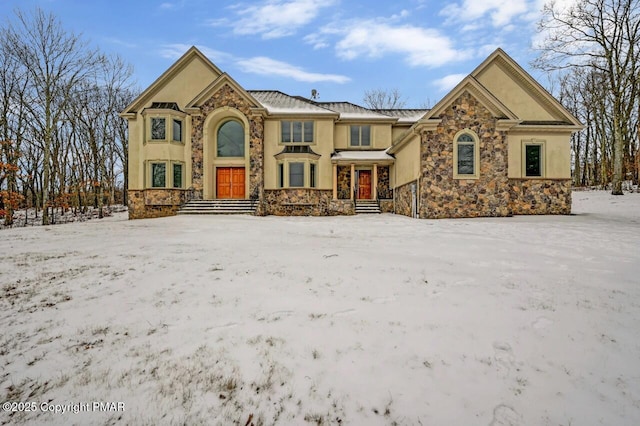 view of front of house with stone siding and stucco siding