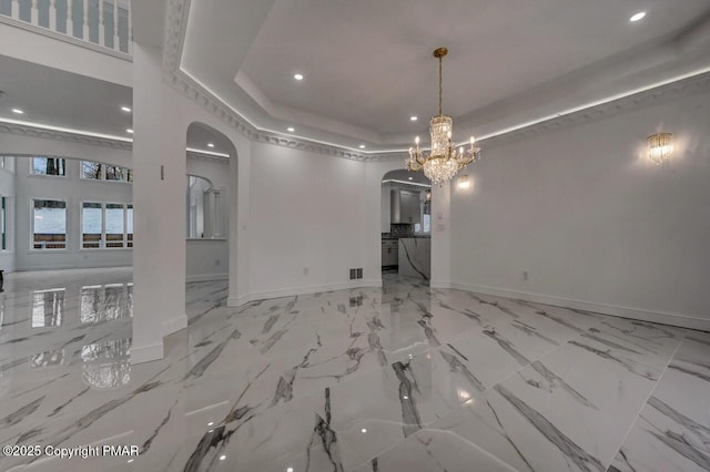 707 Kennedy Ct, East Stroudsburg, PA 18301 - unfurnished dining area featuring arched walkways, a chandelier, baseboards, a tray ceiling, and recessed lighting
