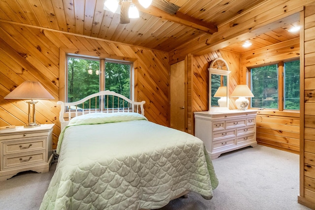 2173 Tuscarora Dr, Pocono Lake, PA 18347 - bedroom with light carpet, wooden walls, and a wooden ceiling with exposed beams