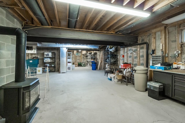 2173 Tuscarora Dr, Pocono Lake, PA 18347 - unfinished basement featuring a wood stove