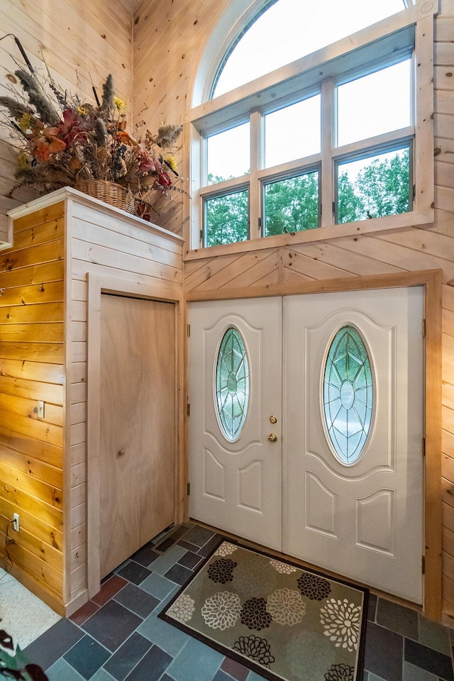 2173 Tuscarora Dr, Pocono Lake, PA 18347 - foyer entrance with a towering ceiling and wood walls