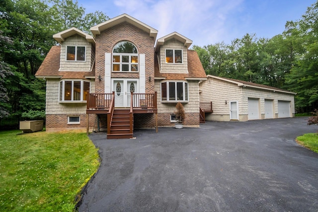 2173 Tuscarora Dr, Pocono Lake, PA 18347 - view of front facade featuring a front lawn and french doors