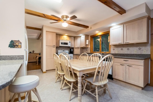 2173 Tuscarora Dr, Pocono Lake, PA 18347 - dining space with ceiling fan, beam ceiling, and light tile patterned floors