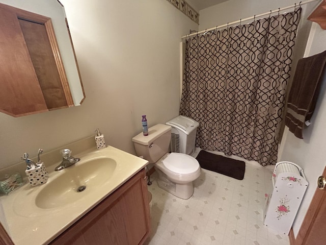 bathroom with vanity, tile patterned floors, toilet, and a shower with shower curtain