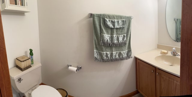 half bath with toilet and vanity