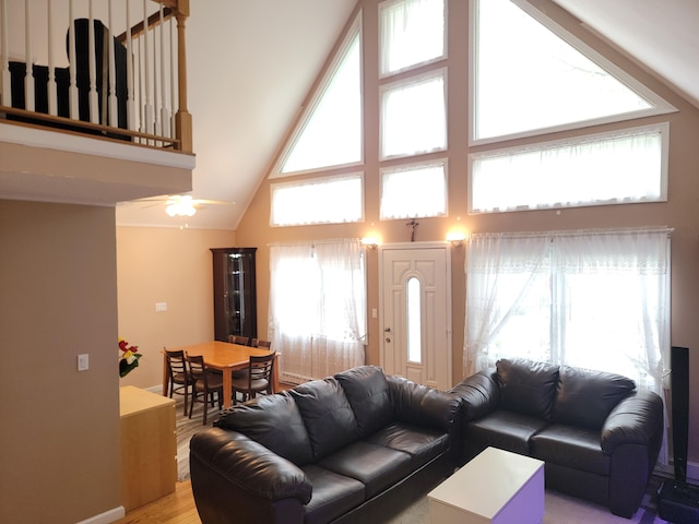 1025 Cricket Ln, Long Pond, PA 18334 - living area featuring high vaulted ceiling, light wood-style floors, and a ceiling fan