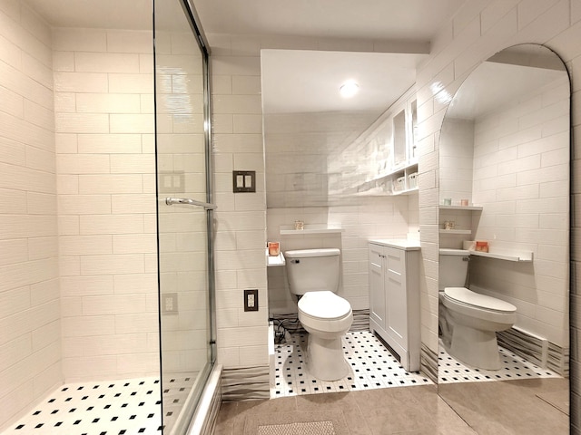 1025 Cricket Ln, Long Pond, PA 18334 - full bathroom featuring a shower stall, tile walls, vanity, and tile patterned floors