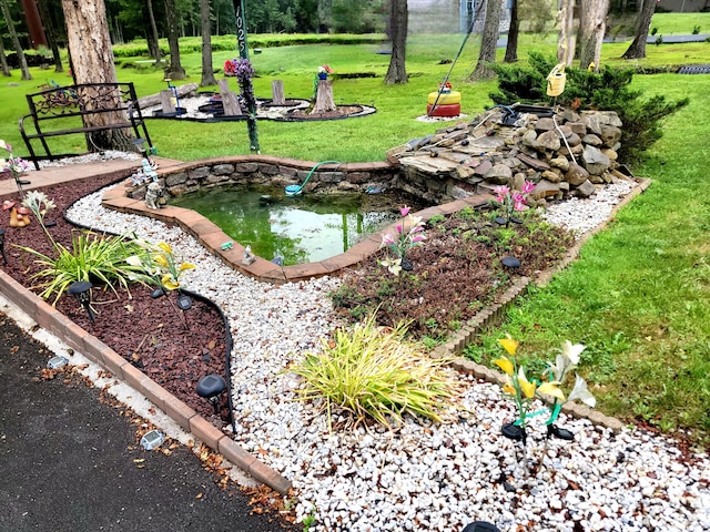 1025 Cricket Ln, Long Pond, PA 18334 - view of grassy yard with a small pond