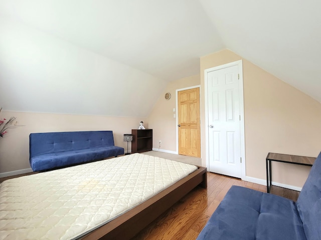 1025 Cricket Ln, Long Pond, PA 18334 - bedroom with wood finished floors and lofted ceiling