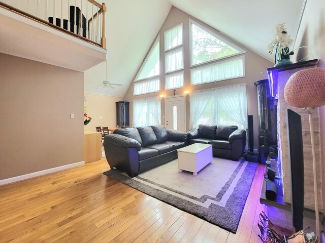 1025 Cricket Ln, Long Pond, PA 18334 - living area featuring hardwood / wood-style flooring, high vaulted ceiling, and ceiling fan