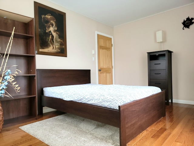 1025 Cricket Ln, Long Pond, PA 18334 - bedroom with wood finished floors and crown molding