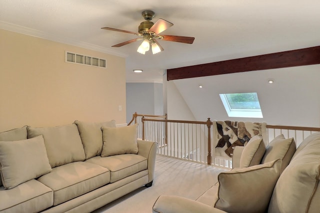 5181 Hilltop Cir E, Stroudsburg, PA 18301 - living room featuring a skylight, ceiling fan, beam ceiling, ornamental molding, and light colored carpet