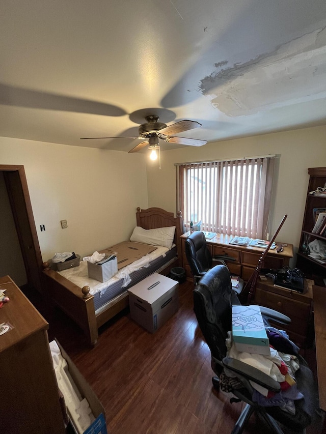 bedroom featuring a ceiling fan and wood finished floors