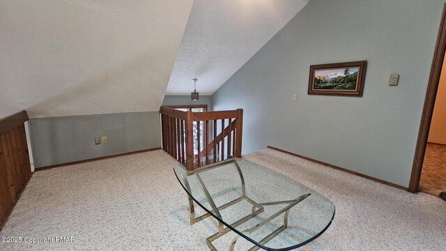 bonus room featuring ceiling fan, carpet, lofted ceiling, and baseboard heating