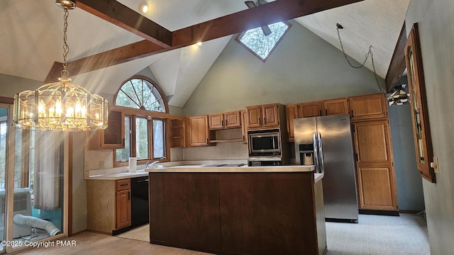 kitchen with beamed ceiling, stainless steel appliances, a chandelier, and hanging light fixtures