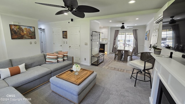 living area with ornamental molding, recessed lighting, ceiling fan, and baseboards