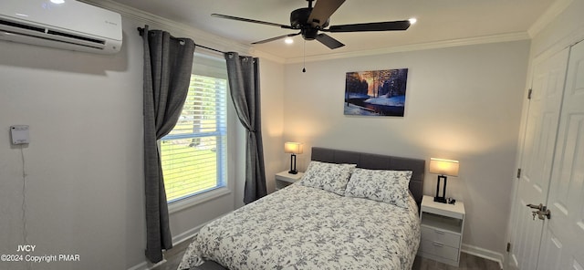 bedroom featuring ornamental molding, a wall unit AC, baseboards, and multiple windows