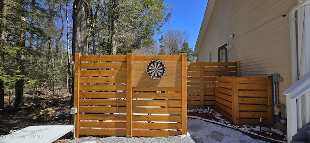 view of gate featuring fence