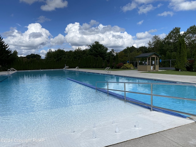 community pool with a patio area